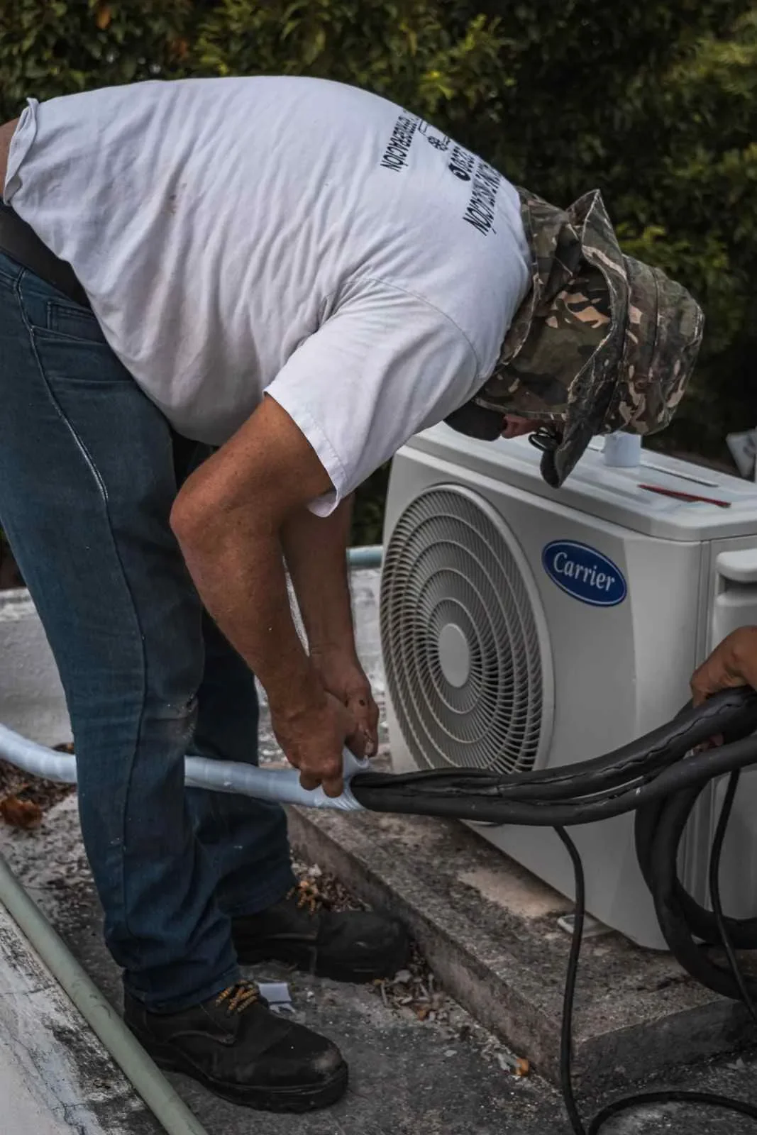 HVAC technician working on outdoor equipment